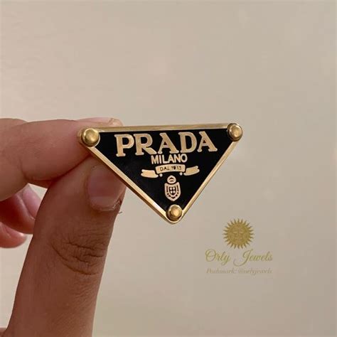 prada flame brooch|prada brooch.